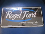 Nos Rogel Ford Crystal Springs, Ms. Metal Booster License Plate. Fixed Price $19.95.